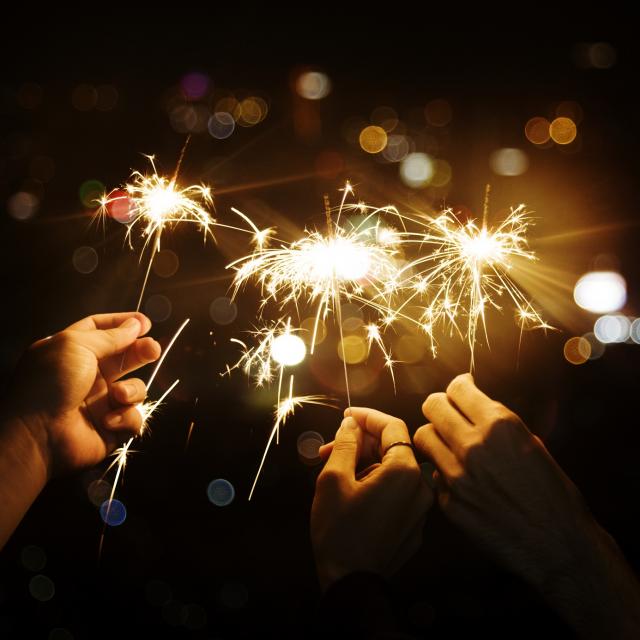 Celebrating with sparklers in the night